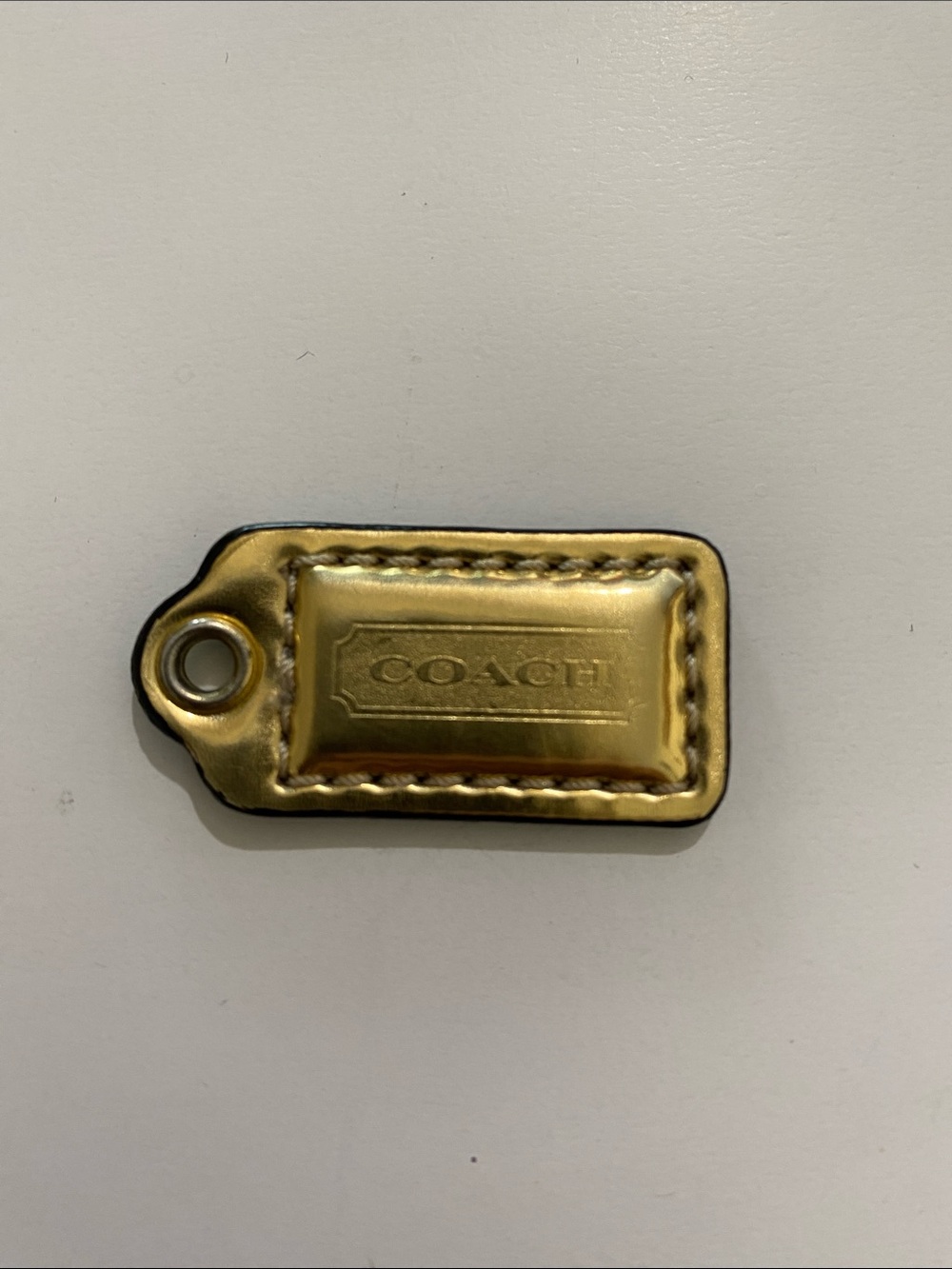Small Coach Metallic Gold Leather Tag Accent